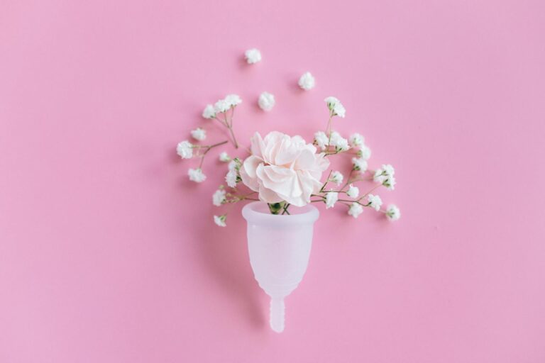 white flowers in white ceramic vase