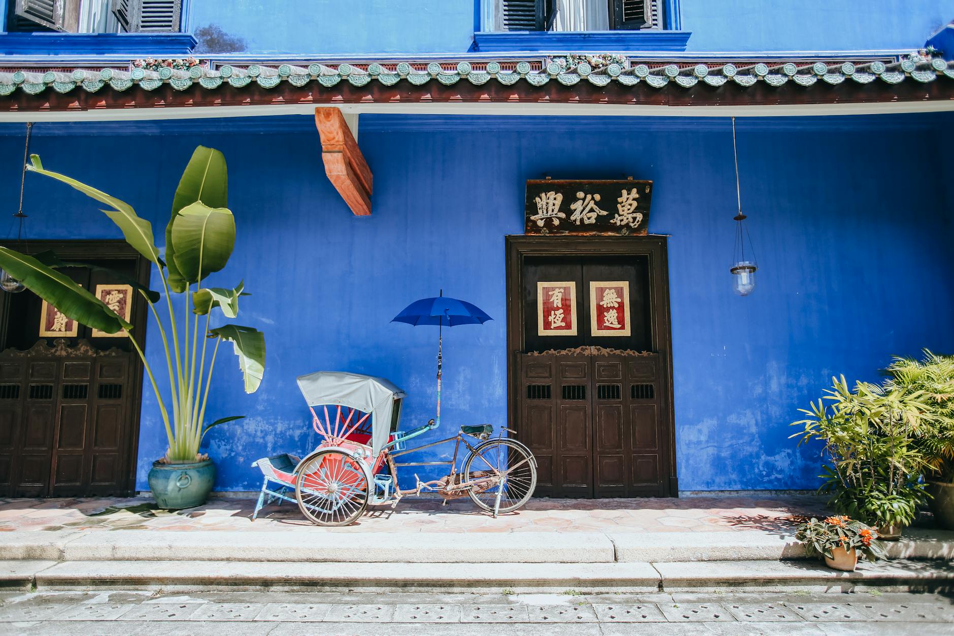 rickshaw and entrance to house