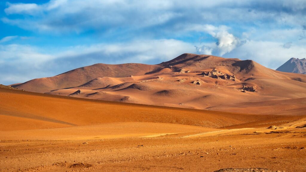 the desert landscape with mountains in the background