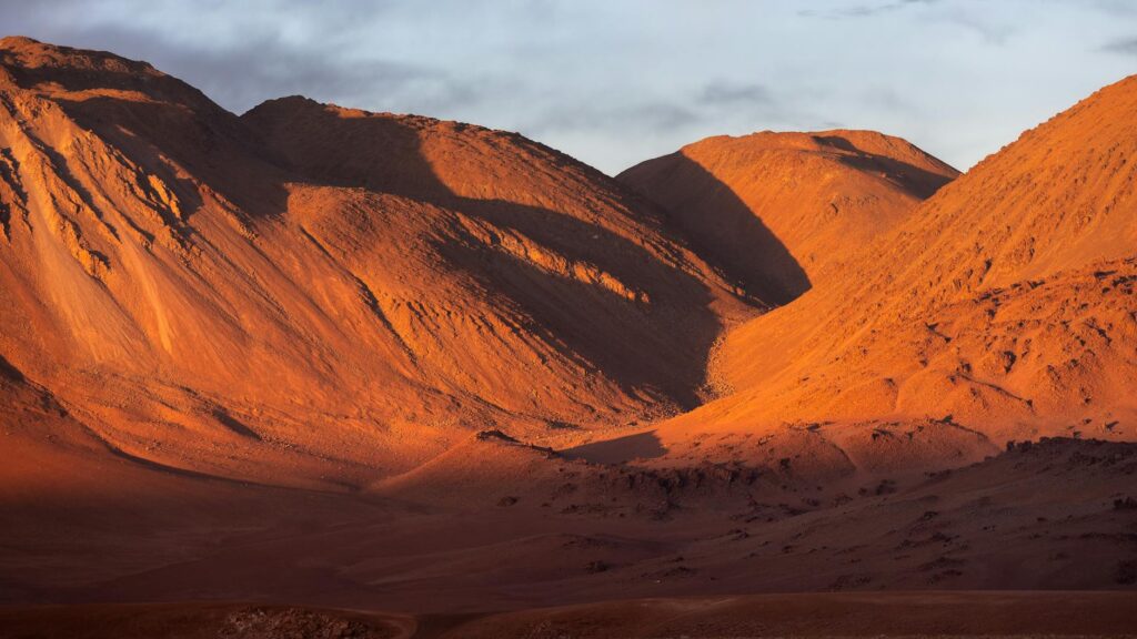 sunset over atacama desert mountains chile