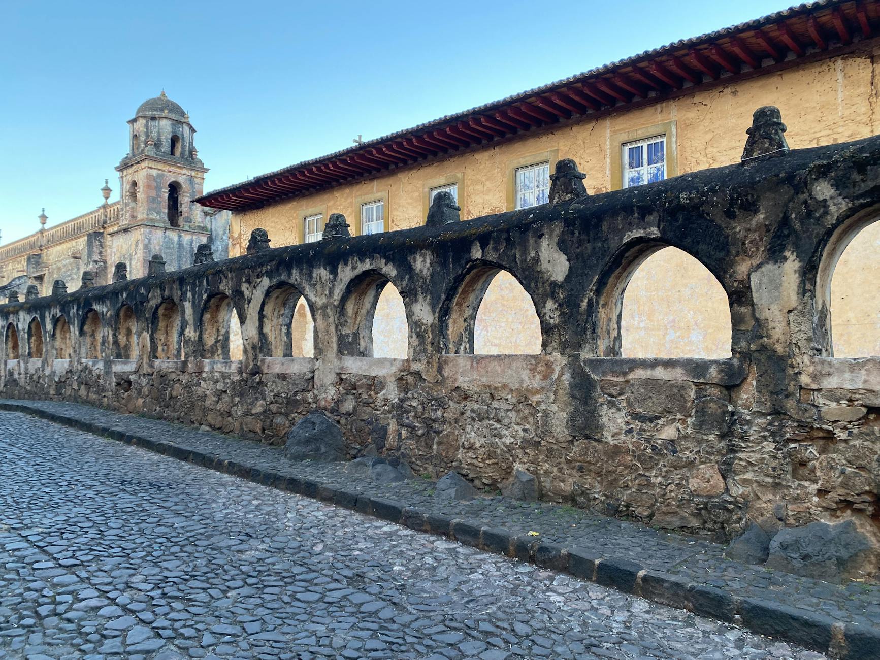 historic arched stone wall in patzcuaro mexico