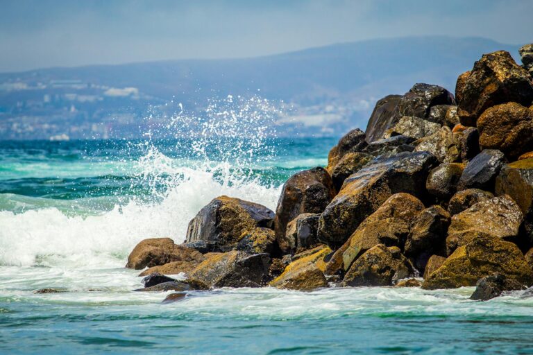 waves crashing on rocky shore in ensenada