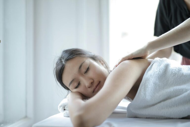 photo of woman getting a back massage