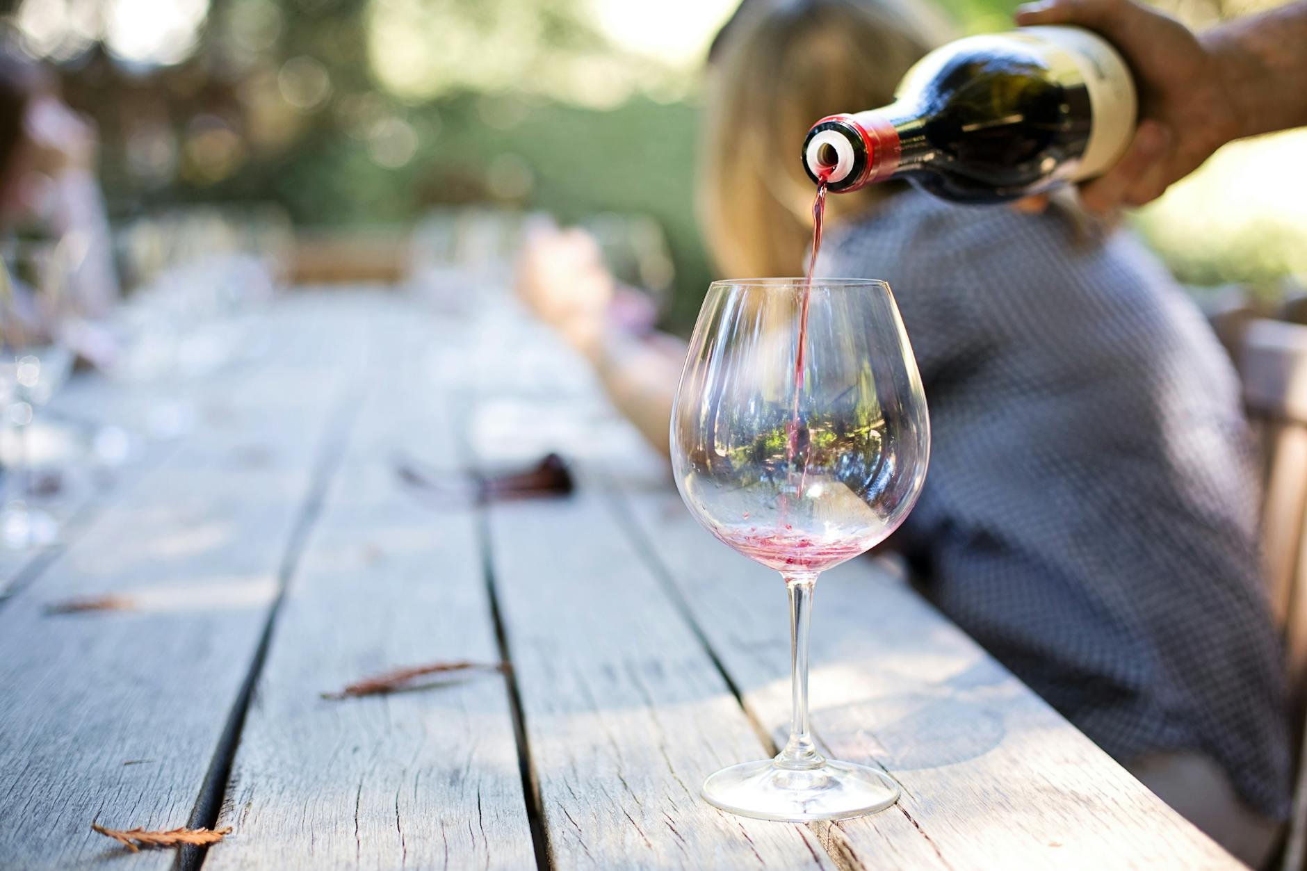 wine poured in long stem glass