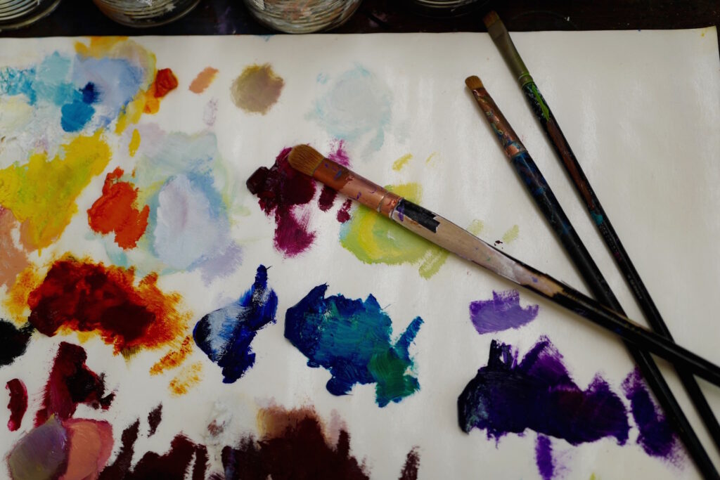 artist paint palette three brushes