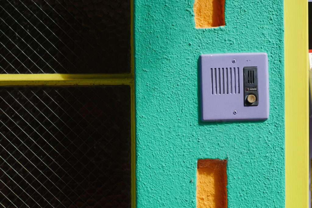artist studio exterior green wall purple intercom