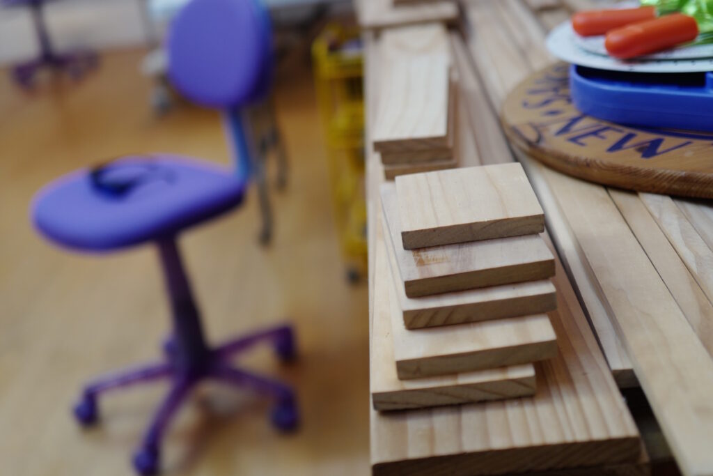 artist studio purple chair wood blocks