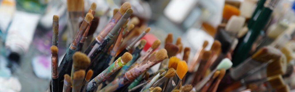 artist studio paintbrushes fill frame panorama