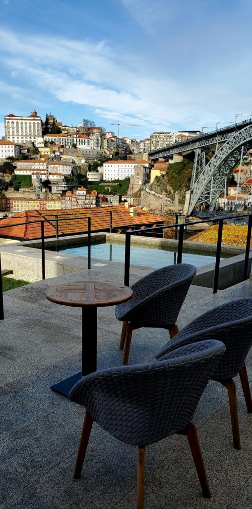 Rooftop terrace at Porto River Soul Hotel overlooking the Dom Luís I Bridge and Douro River in Porto