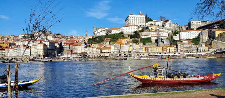 Rabelo boats on the Douro River with Porto’s Ribeira riverfront in the background