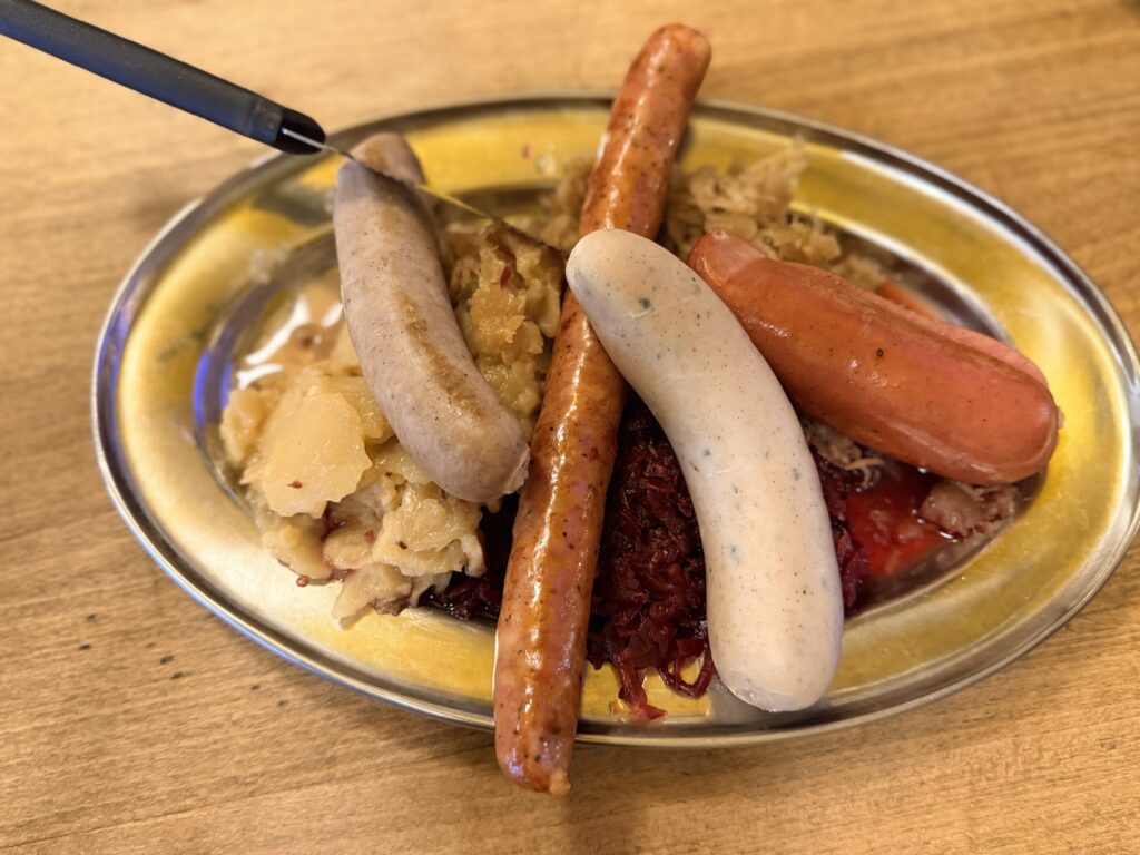 This image show a sampler plate of Usinger's sausages.The most famous being their beloved bratwurst.