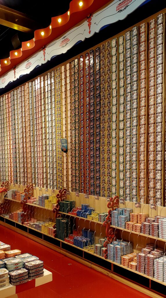 Wall display of colorful Portuguese sardine tins in Fantastic World of the Portuguese Sardine tourist shop. 

