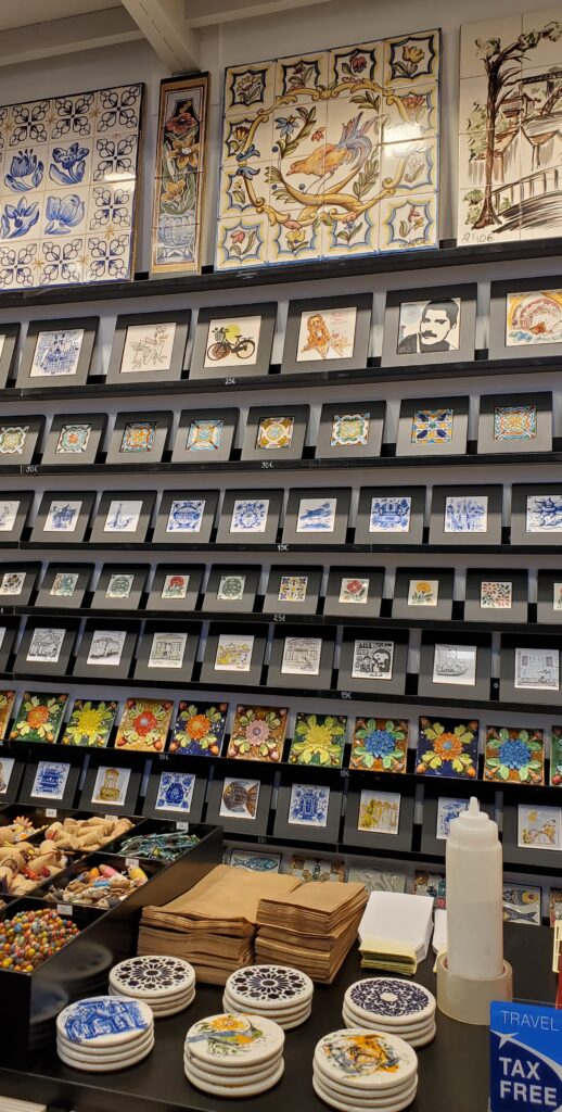 Display of hand-painted Portuguese azulejo tiles in Prometeu Artesanto, an art cooperative shop in Porto
